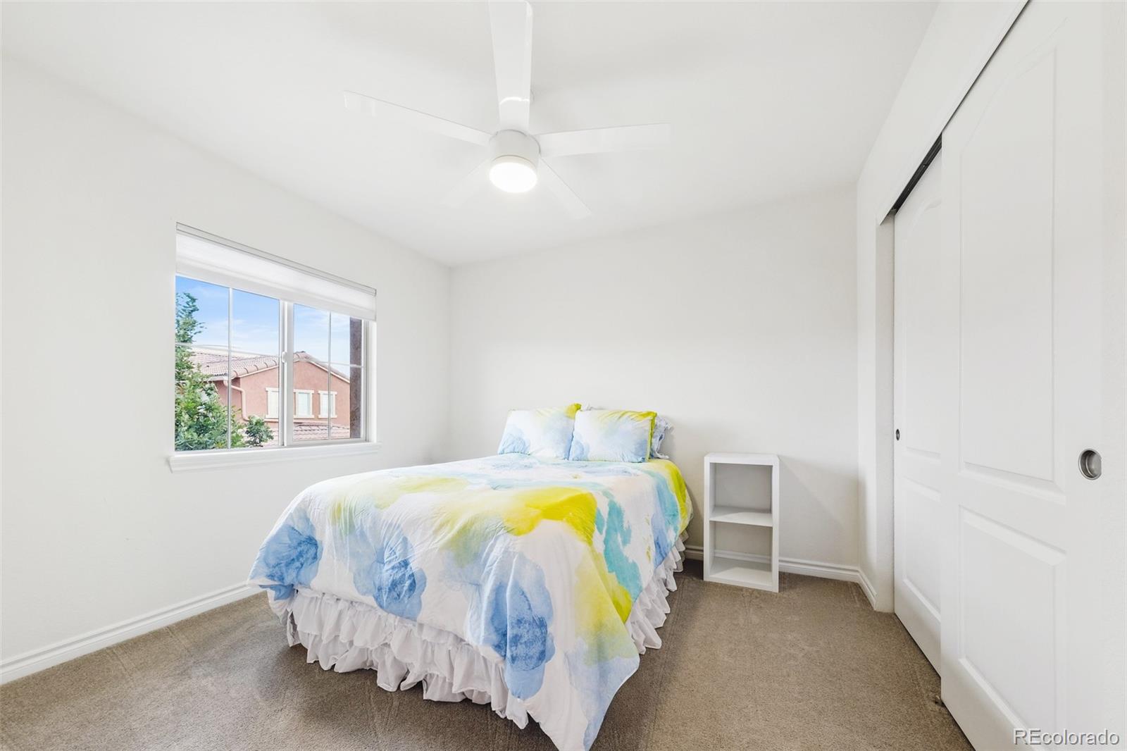 9550 Rosato Court Highlands Ranch, CO 80126 - Photo 20 of 27 a bedroom with a bed and a window