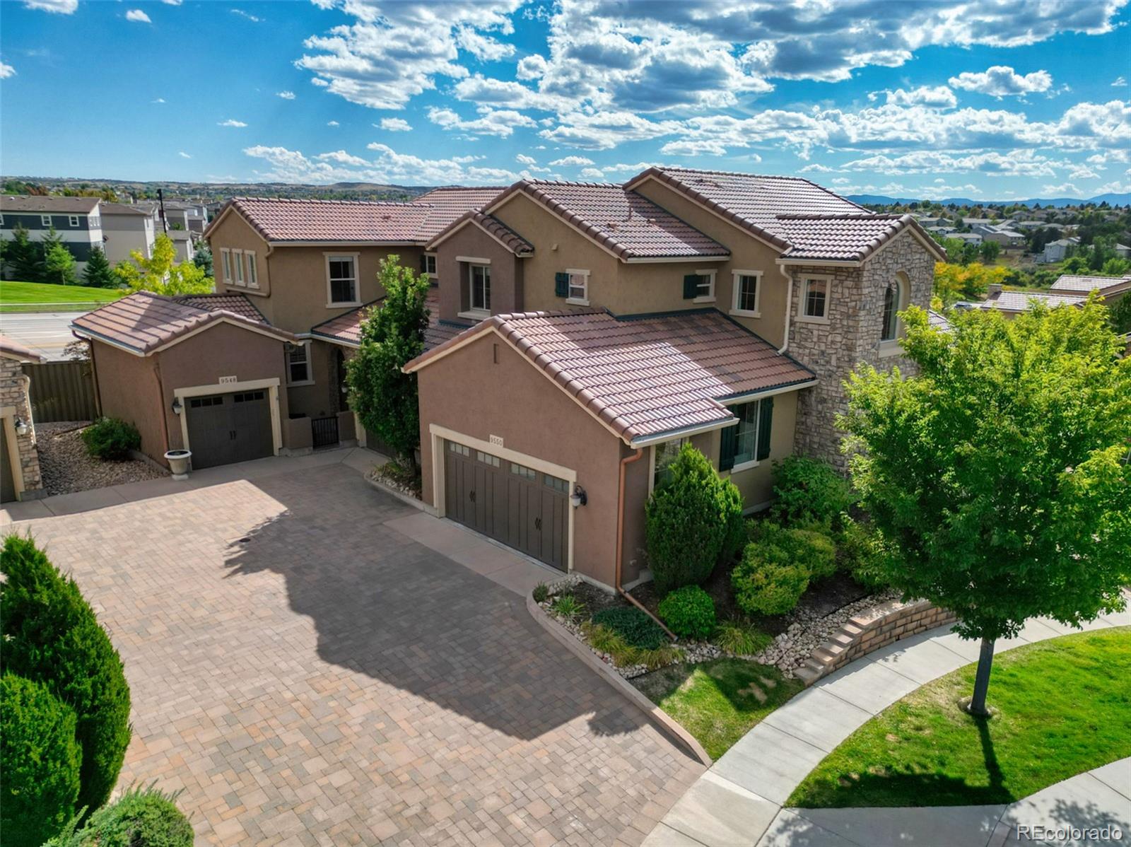 9550 Rosato Court Highlands Ranch, CO 80126 - Photo 4 of 27 a aerial view of a house with a yard and potted plants
