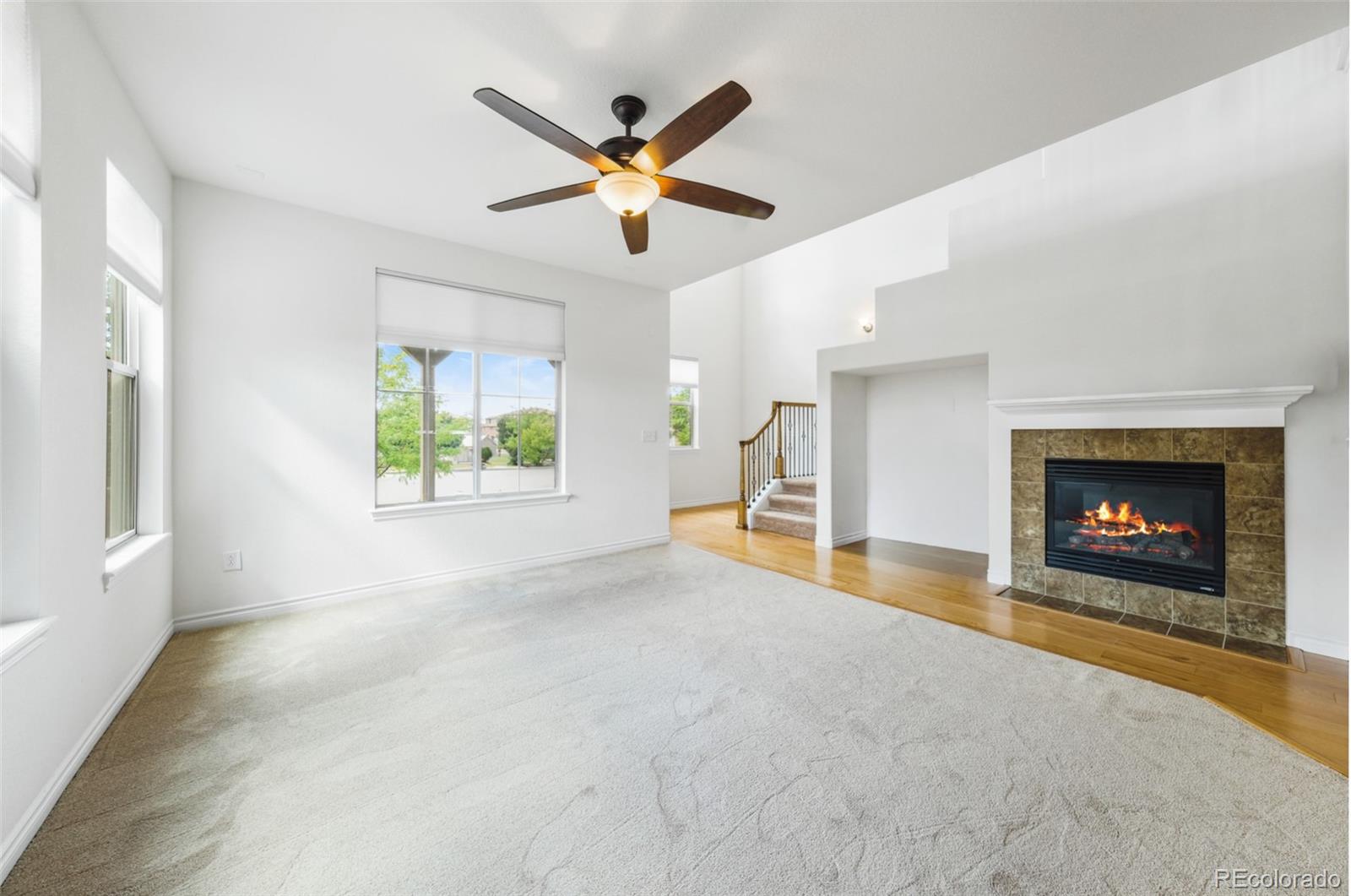 9550 Rosato Court Highlands Ranch, CO 80126 - Photo 7 of 27 a view of a livingroom with a fireplace and window