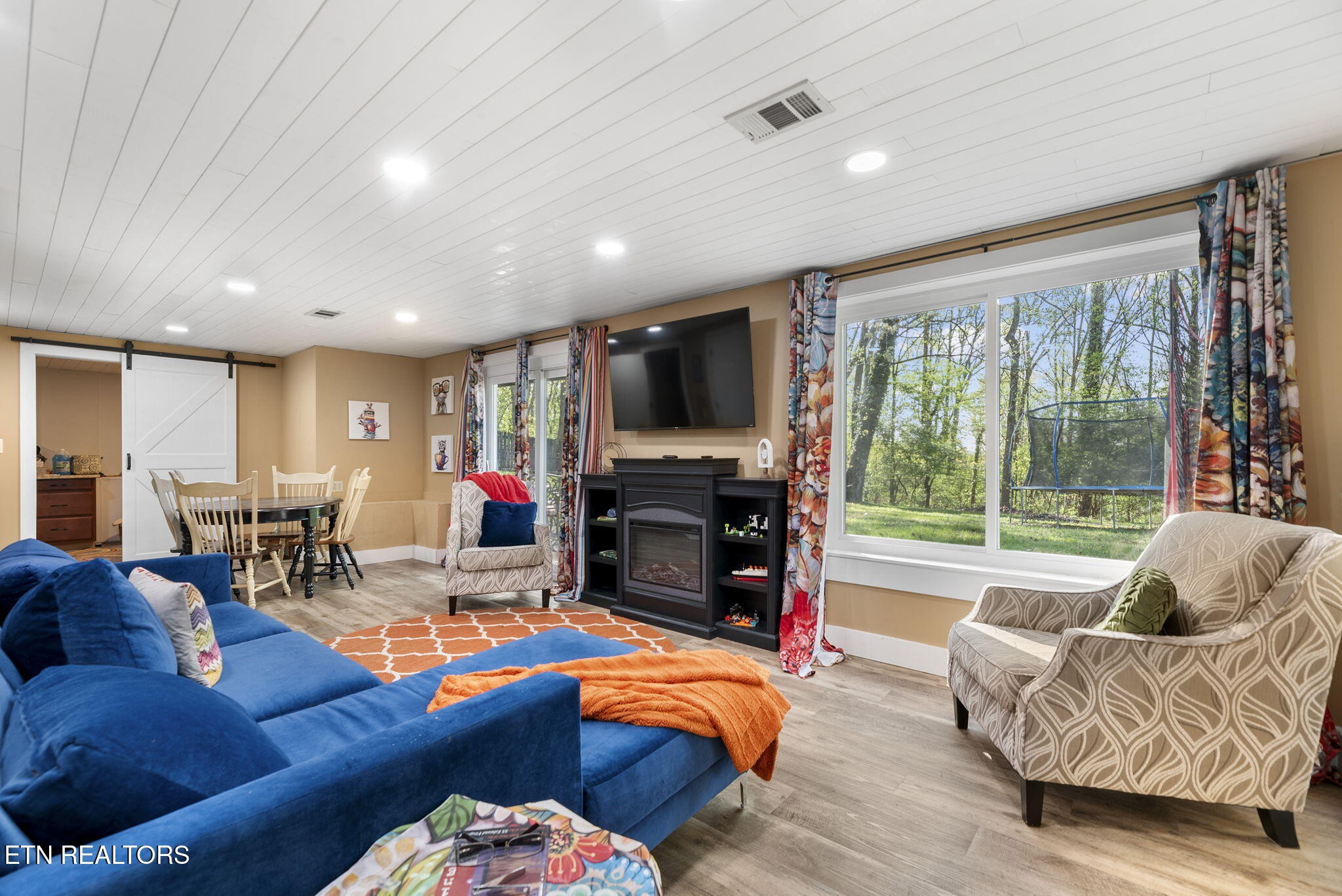 83 Outer Drive Oak Ridge, TN 37830 - Photo 29 of 37 a living room with fireplace furniture and a flat screen tv