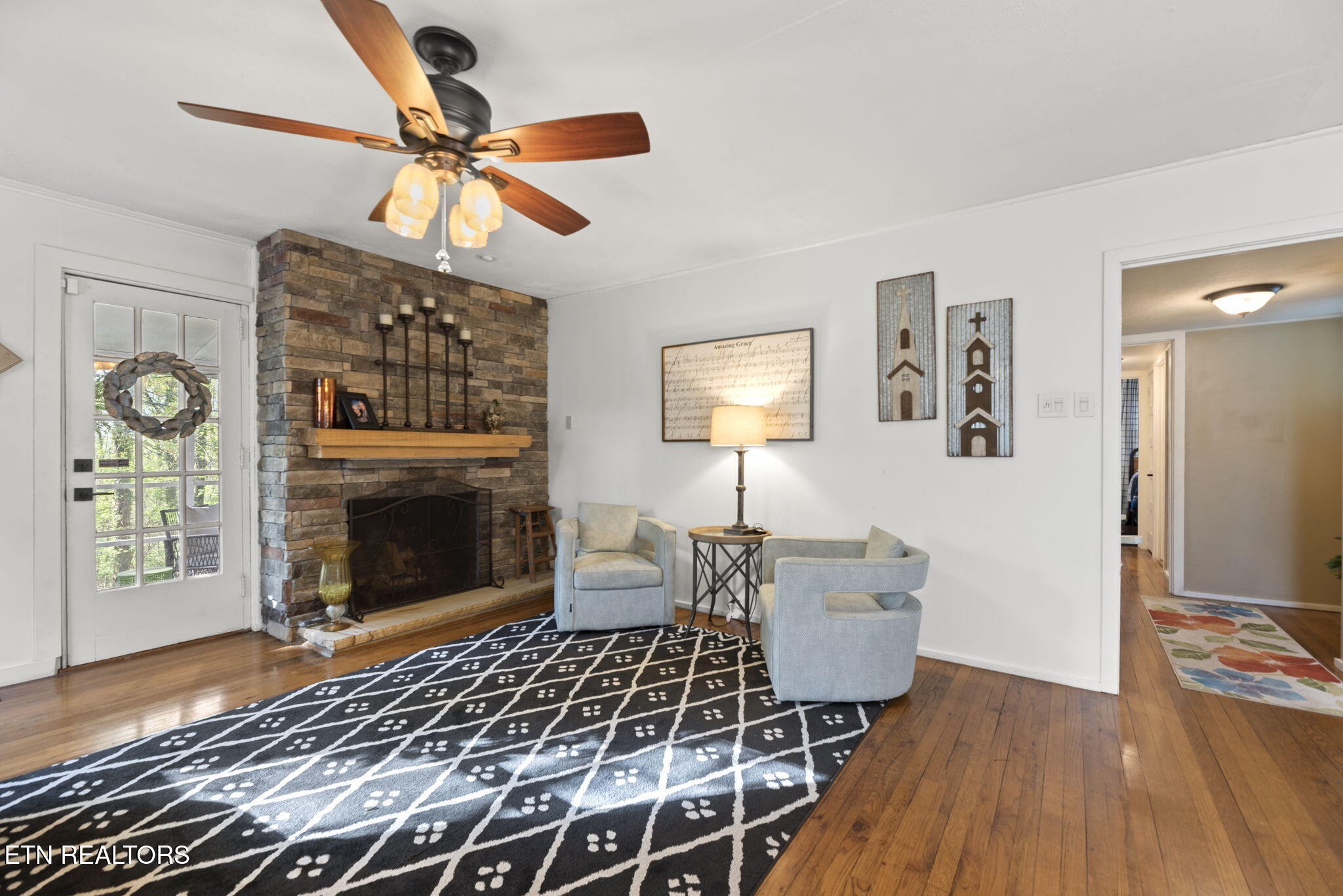 83 Outer Drive Oak Ridge, TN 37830 - Photo 10 of 37 a living room with furniture a fireplace and a table