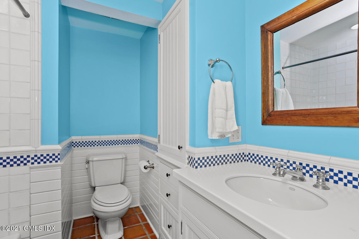 175 Cat Rock Road Cos Cob, CT 06807 - Photo 32 of 72 a bathroom with a sink a toilet and a mirror