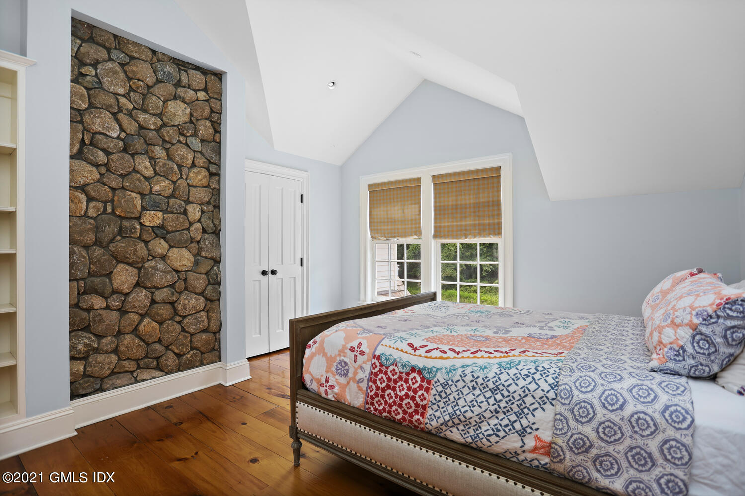 175 Cat Rock Road Cos Cob, CT 06807 - Photo 34 of 72 a bedroom with a bed and a window with chair