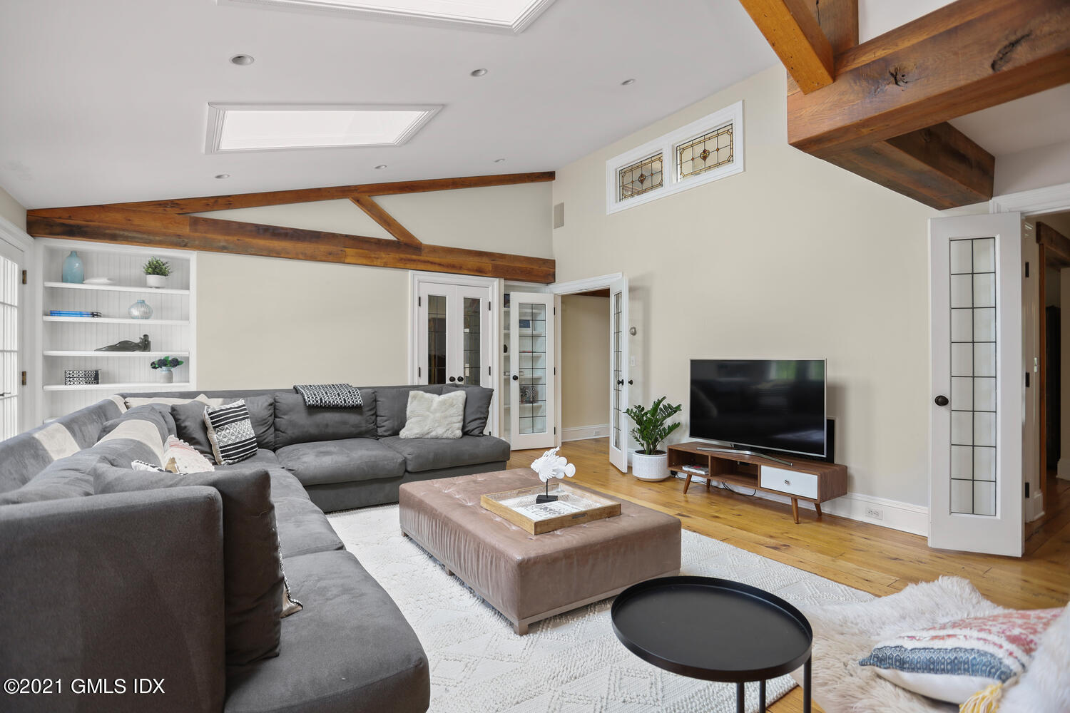175 Cat Rock Road Cos Cob, CT 06807 - Photo 4 of 72 a living room with furniture and a flat screen tv