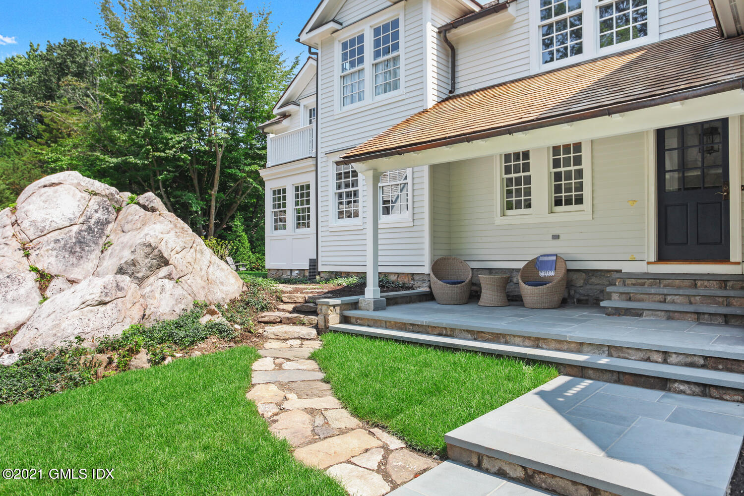 175 Cat Rock Road Cos Cob, CT 06807 - Photo 46 of 72 a front view of a house with garden