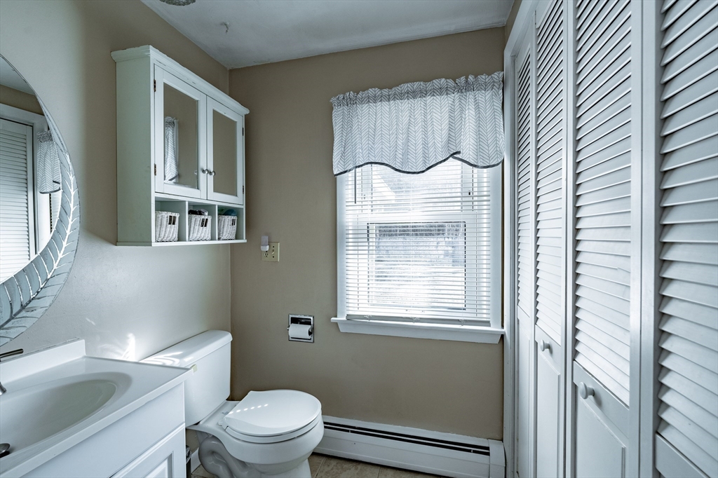 241 Mallowhill Road Springfield, MA 01129 - Photo 11 of 34 a bathroom with a granite countertop toilet sink and mirror