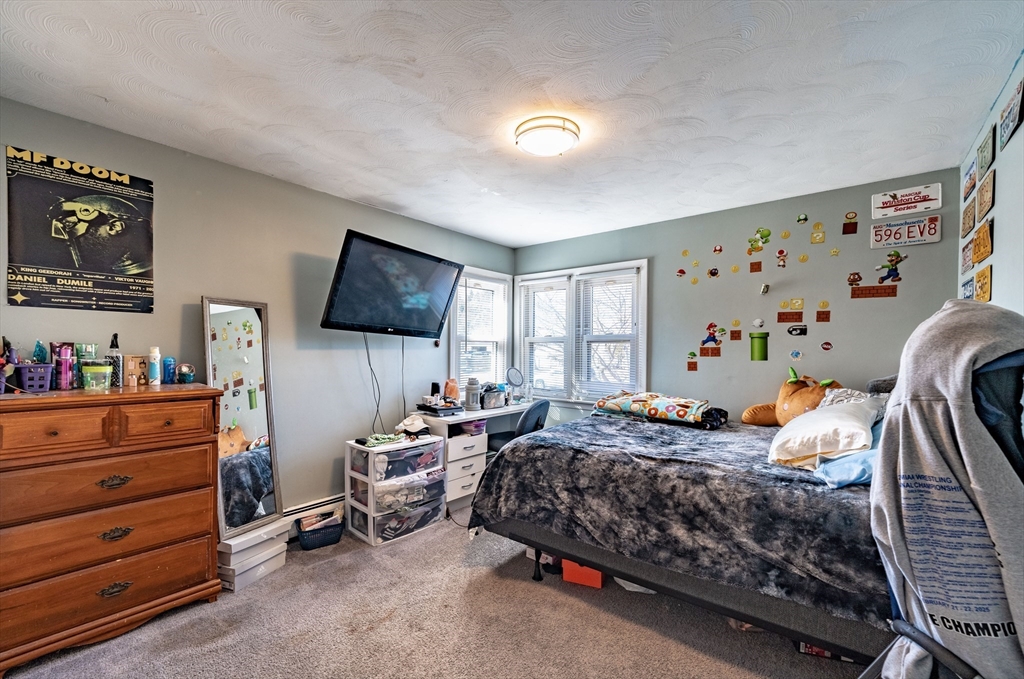 241 Mallowhill Road Springfield, MA 01129 - Photo 19 of 34 a bedroom with furniture and a flat screen tv