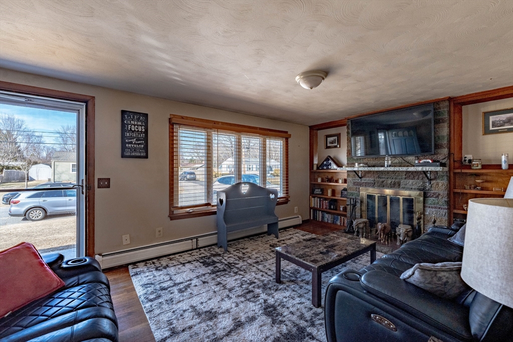 241 Mallowhill Road Springfield, MA 01129 - Photo 3 of 34 a living room with furniture and a fireplace