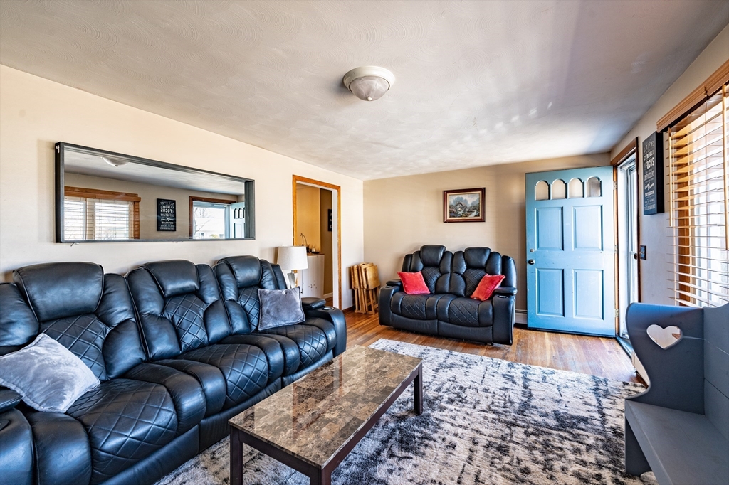 241 Mallowhill Road Springfield, MA 01129 - Photo 6 of 34 a living room with furniture ceiling fan and a window