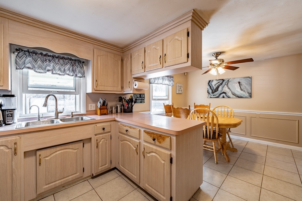 241 Mallowhill Road Springfield, MA 01129 - Photo 10 of 34 a kitchen with cabinets a sink and appliances