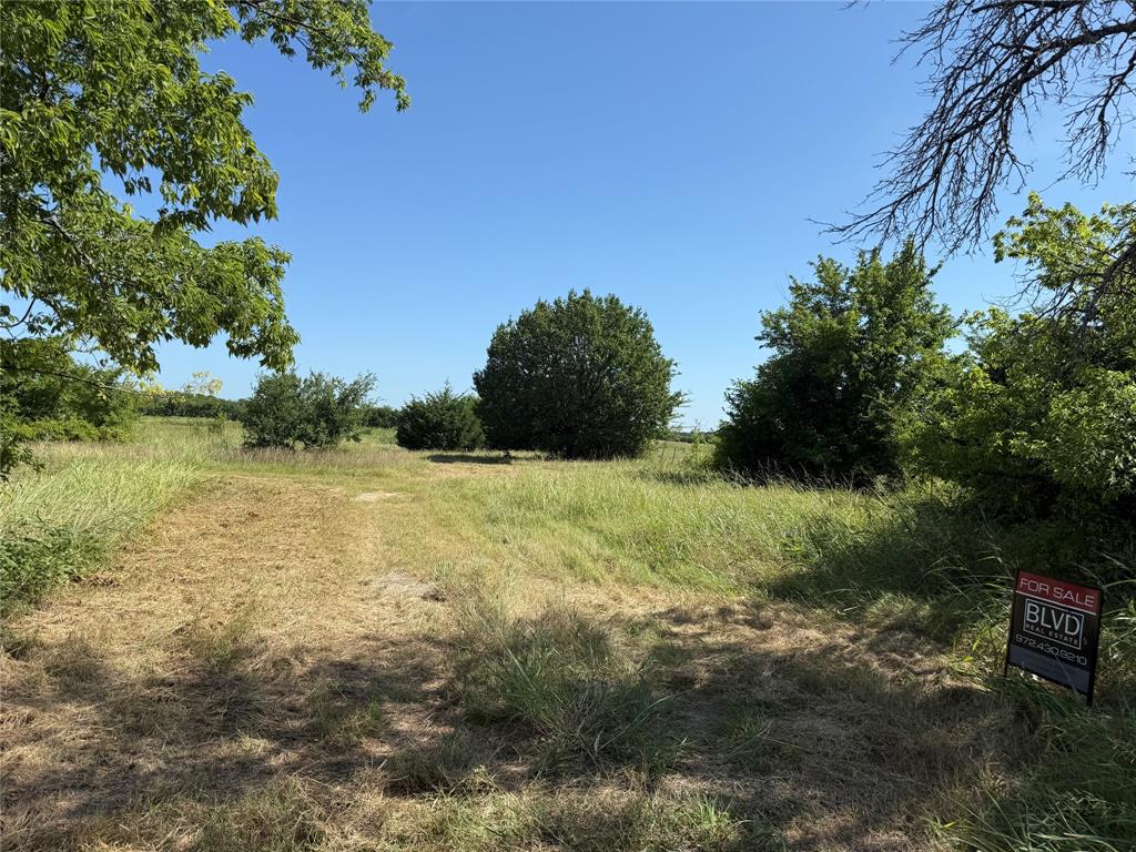 1 County Road 5045 Leonard, TX 75452 - Photo 15 of 23 a view of a lake with a yard