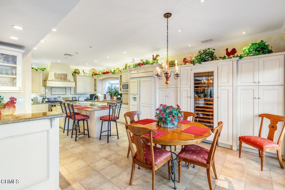 2300 Peninsula Road Oxnard, CA 93035 - Photo 16 of 54 a view of a dining room and livingroom with furniture table & chairs