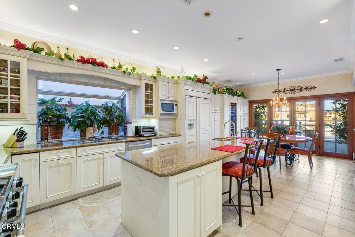 2300 Peninsula Road Oxnard, CA 93035 - Photo 18 of 54 a very nice looking dining room with a large dining table and chairs