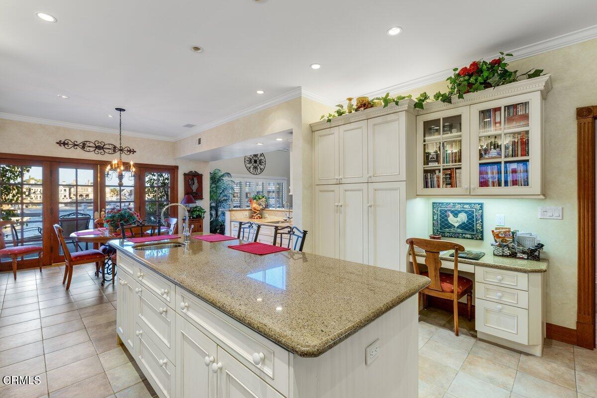 2300 Peninsula Road Oxnard, CA 93035 - Photo 20 of 54 a kitchen with stainless steel appliances granite countertop a sink and cabinets
