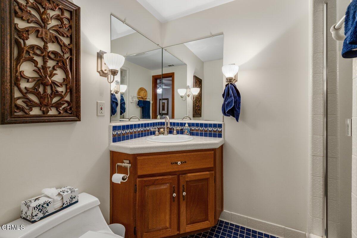2300 Peninsula Road Oxnard, CA 93035 - Photo 23 of 54 a view of bathroom with a sink and a mirror