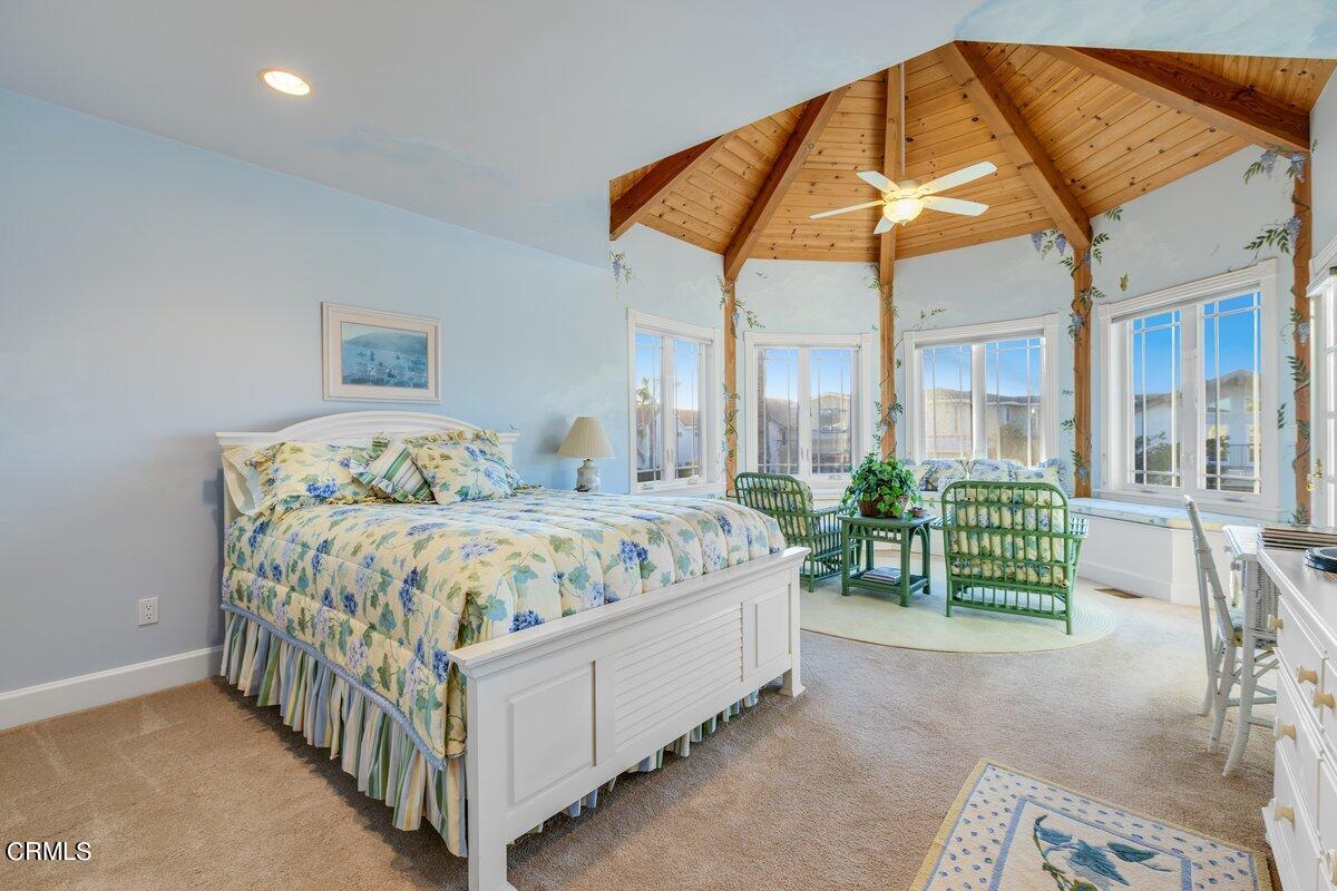 2300 Peninsula Road Oxnard, CA 93035 - Photo 25 of 54 a bedroom with a bed and a table