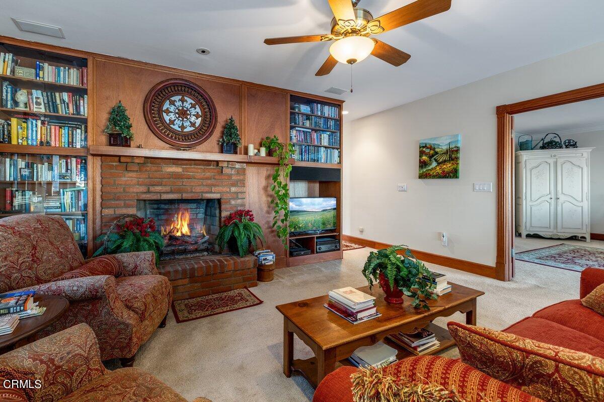 2300 Peninsula Road Oxnard, CA 93035 - Photo 33 of 54 a living room with furniture and a fireplace