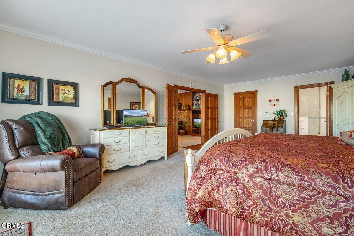 2300 Peninsula Road Oxnard, CA 93035 - Photo 34 of 54 a spacious bedroom with a bed a dresser and a window