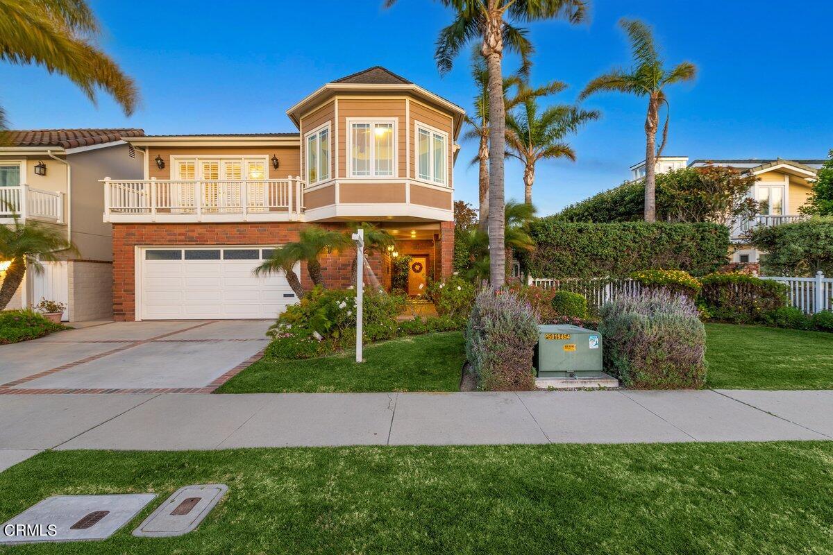 2300 Peninsula Road Oxnard, CA 93035 - Photo 5 of 54 a front view of a house with a yard