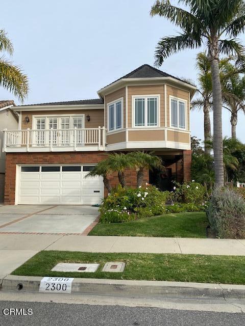 2300 Peninsula Road Oxnard, CA 93035 - Photo 53 of 54 a front view of a house with a garden