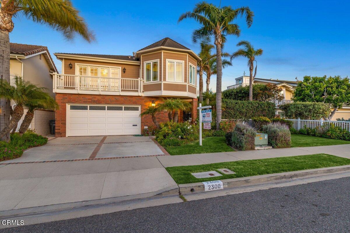 2300 Peninsula Road Oxnard, CA 93035 - Photo 54 of 54 a front view of a house with a yard and potted plants