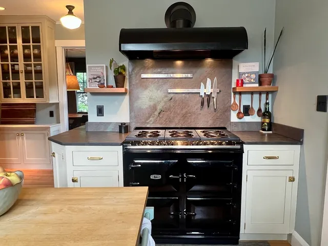 a kitchen with a stove and a cabinets