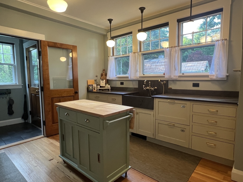 211 Forest Street Winchester, MA 01890 - Photo 13 of 41 a kitchen with sink and window