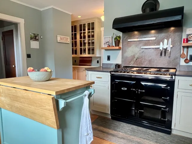 a kitchen with a stove and a refrigerator
