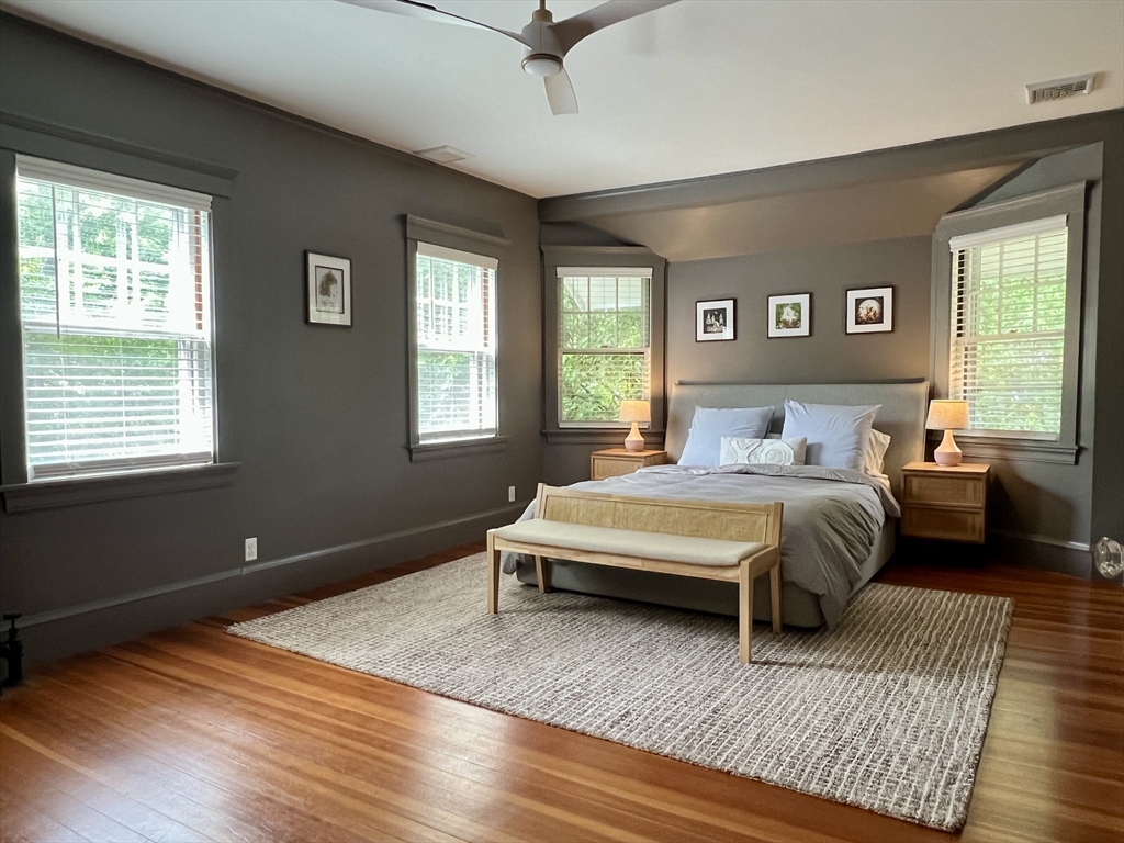 211 Forest Street Winchester, MA 01890 - Photo 19 of 41 a bedroom with a large bed and a window