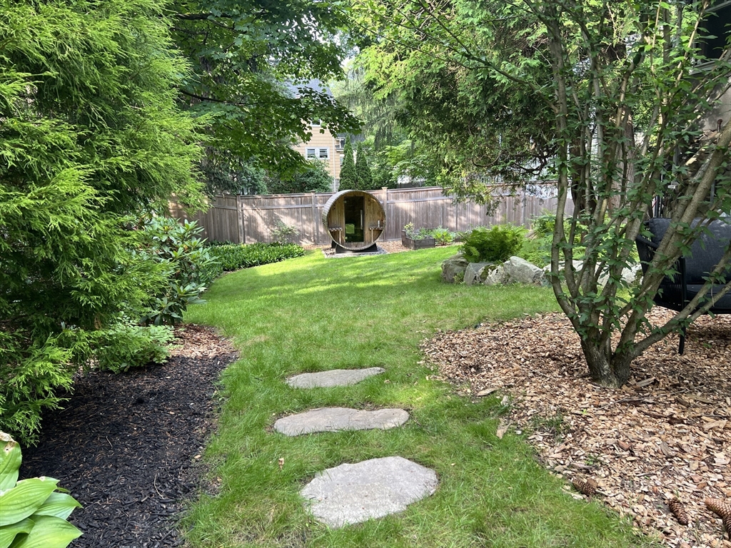 211 Forest Street Winchester, MA 01890 - Photo 2 of 41 a view of garden with trees and flowers
