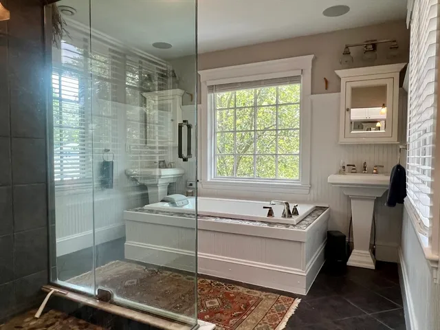 a bathroom with a toilet and shower