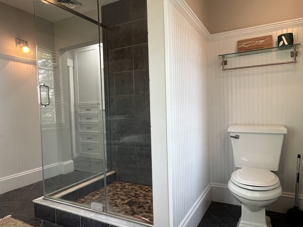 211 Forest Street Winchester, MA 01890 - Photo 22 of 41 a bathroom with a toilet and shower