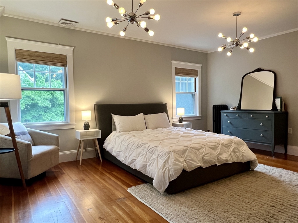 211 Forest Street Winchester, MA 01890 - Photo 24 of 41 a bedroom with a bed and window