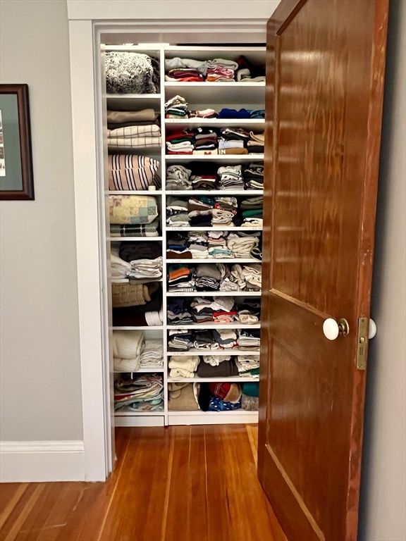 211 Forest Street Winchester, MA 01890 - Photo 26 of 41 a view of walk in closet with clothes and shoes
