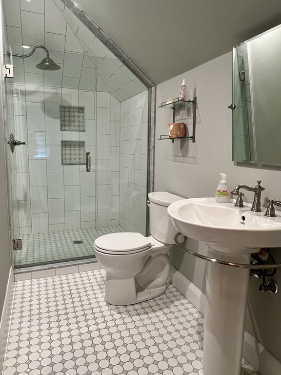 211 Forest Street Winchester, MA 01890 - Photo 29 of 41 a bathroom with a sink toilet and shower