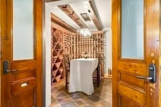a view of a dining table and chairs in the patio