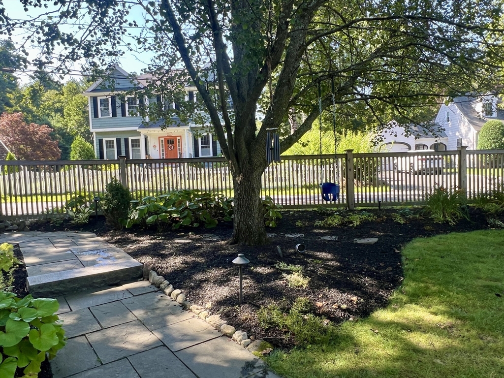211 Forest Street Winchester, MA 01890 - Photo 36 of 41 a front view of a house with garden