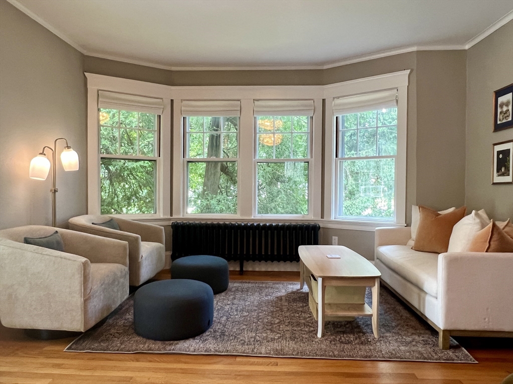 211 Forest Street Winchester, MA 01890 - Photo 4 of 41 a living room with furniture and a large window