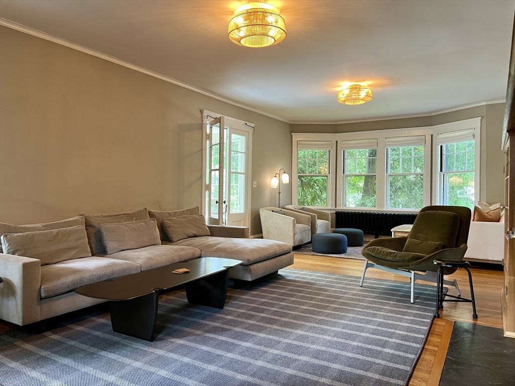 211 Forest Street Winchester, MA 01890 - Photo 6 of 41 a living room with furniture and a large window