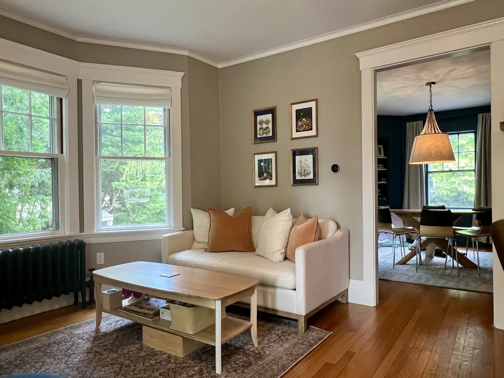 211 Forest Street Winchester, MA 01890 - Photo 8 of 41 a living room with furniture a window and wooden floor