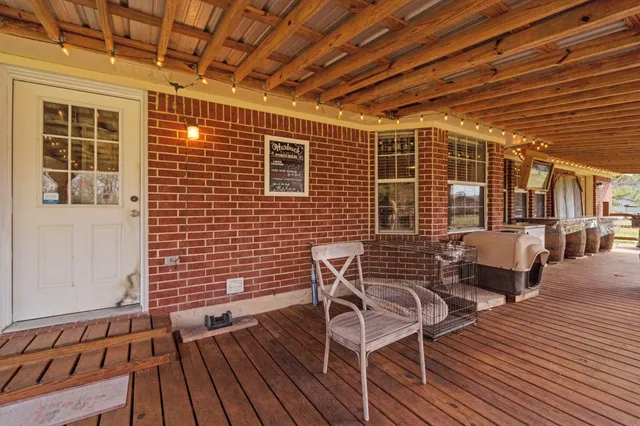 a view of patio with wooden floor