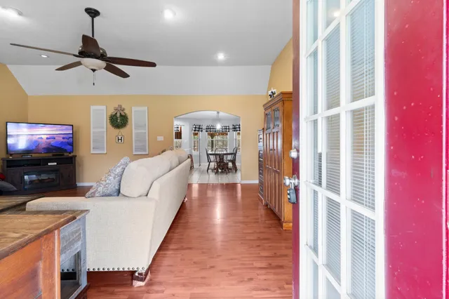 a living room with furniture and a flat screen tv