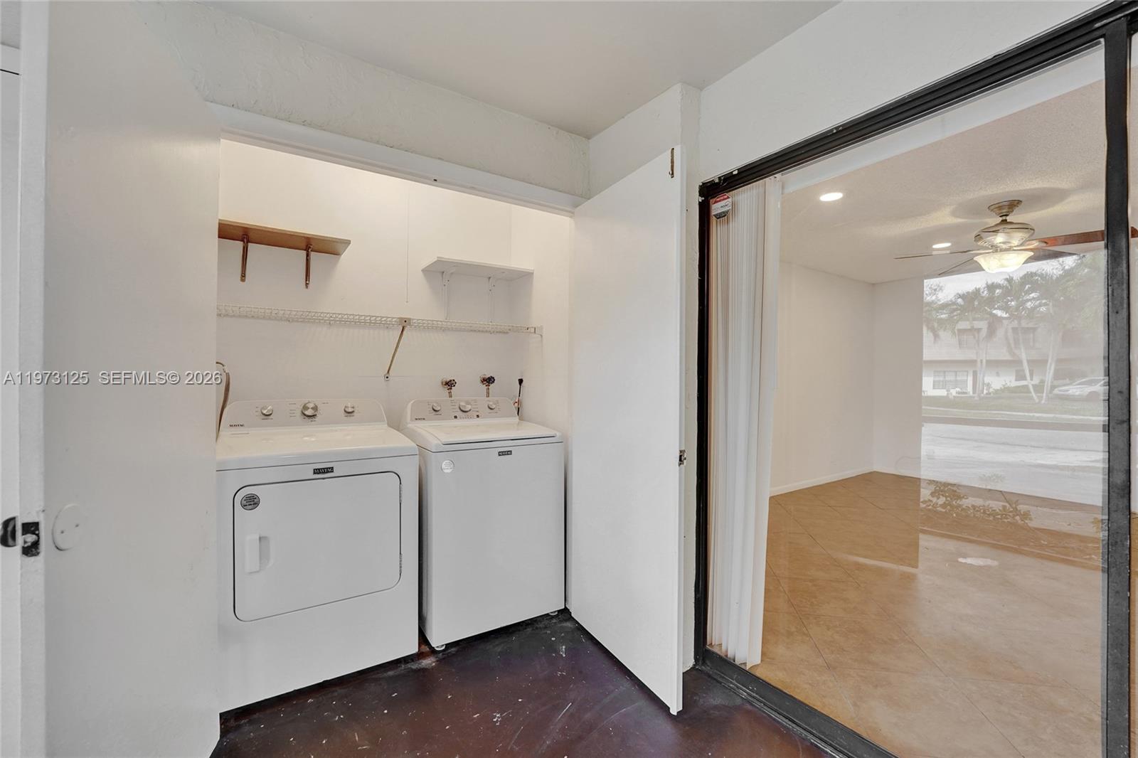 9340 Southwest 61st Way, Unit B Boca Raton, FL 33428 - Photo 19 of 25 a view of utility room with closet and wooden floor