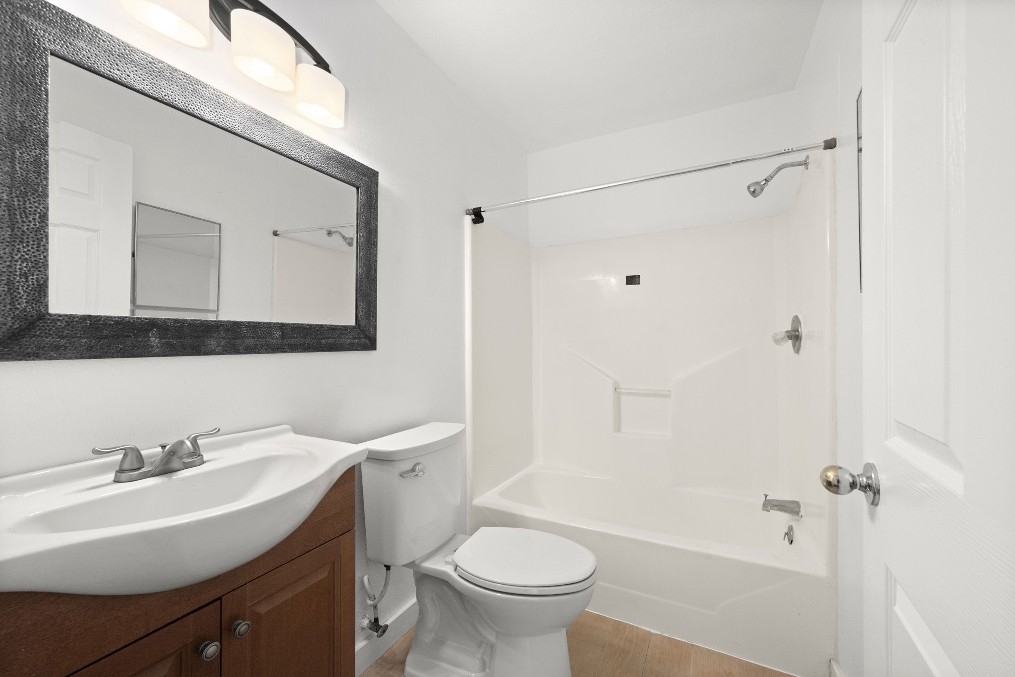 1935 1st Street Hempstead, TX 77445 - Photo 22 of 29 a bathroom with a sink toilet and shower