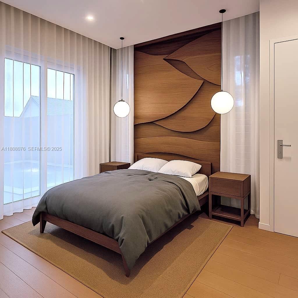 1153 Southwest 22nd Terrace Miami, FL 33129 - Photo 6 of 7 a bedroom with a bed and a painting on the wall