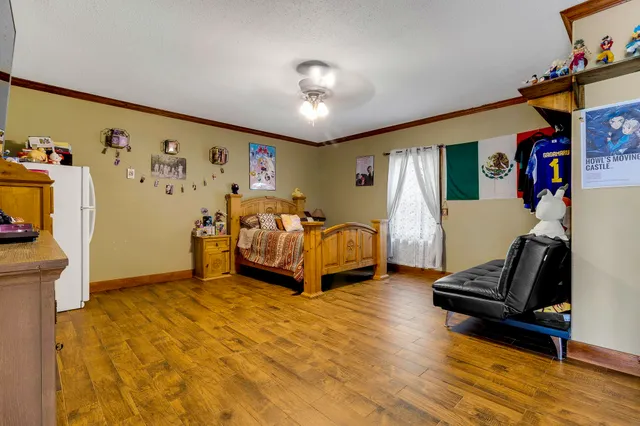 a view of hallway with wooden floor