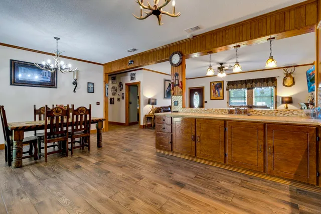 a kitchen with stainless steel appliances granite countertop a sink and cabinets