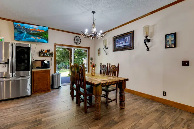 a dining room with furniture window wooden floor