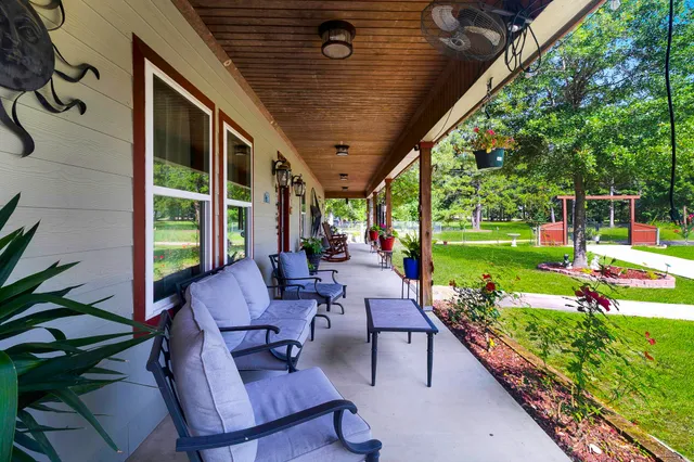a patio with yard table and chairs
