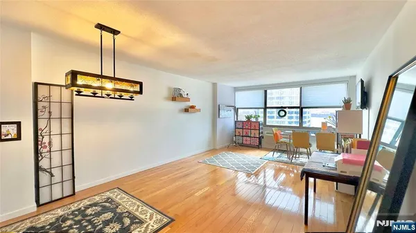 a view of a living room and dining room